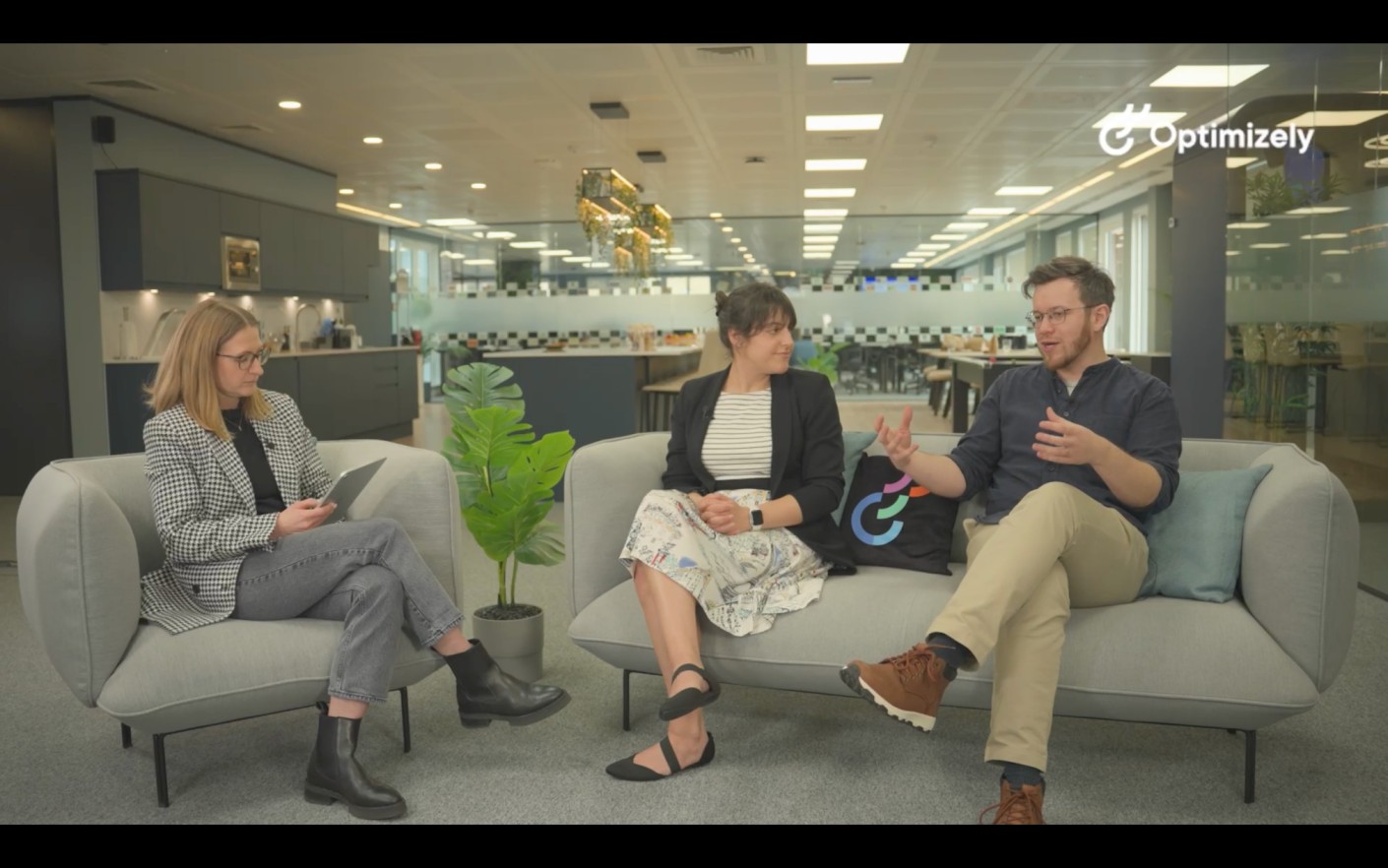 three folks having a fireside chat